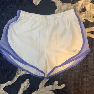White Nike shorts with purple accents